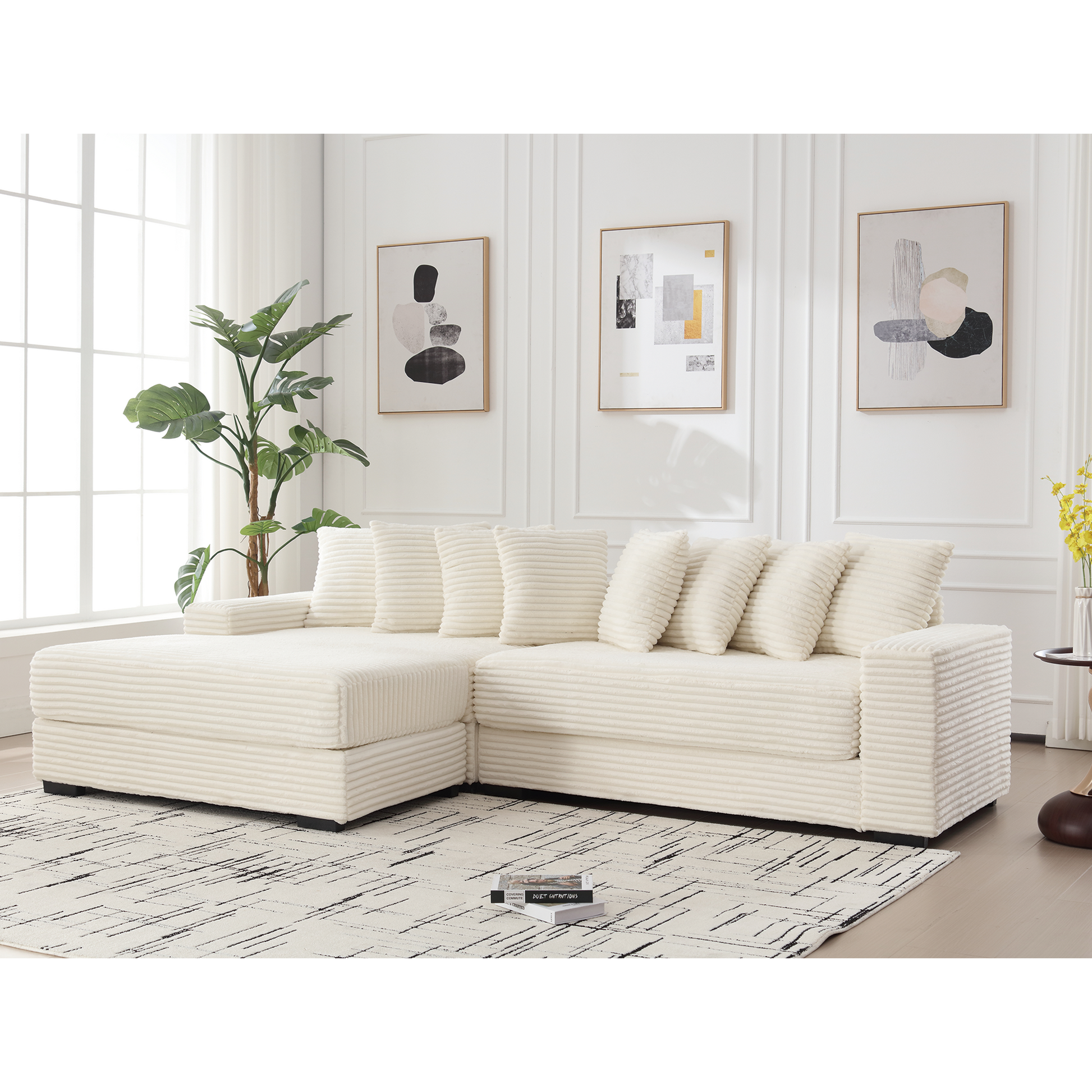 Plush cream corduroy sectional sofa with matching throw pillows on a modern rug