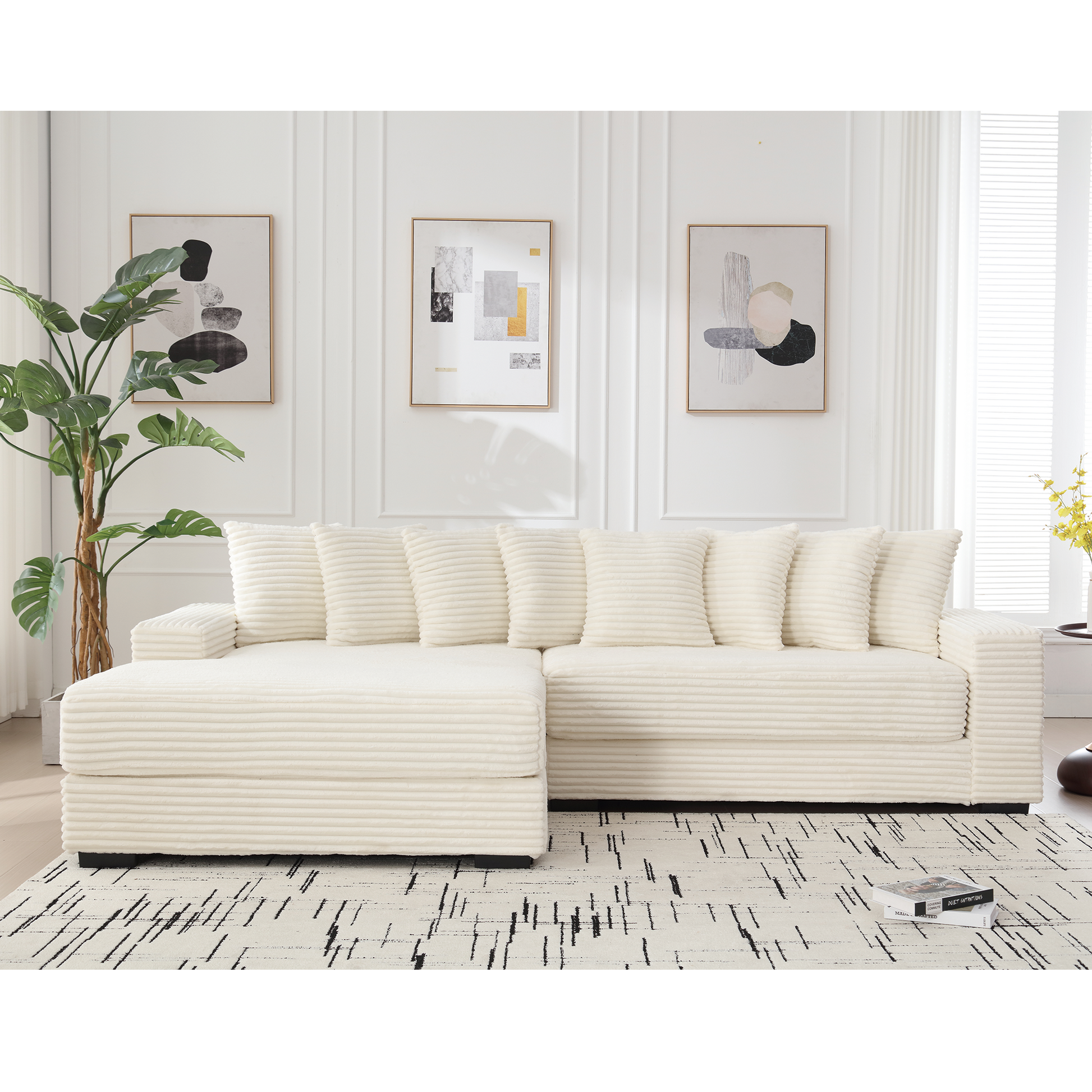 Cream corduroy sectional sofa with plush pillows in a modern living room setting