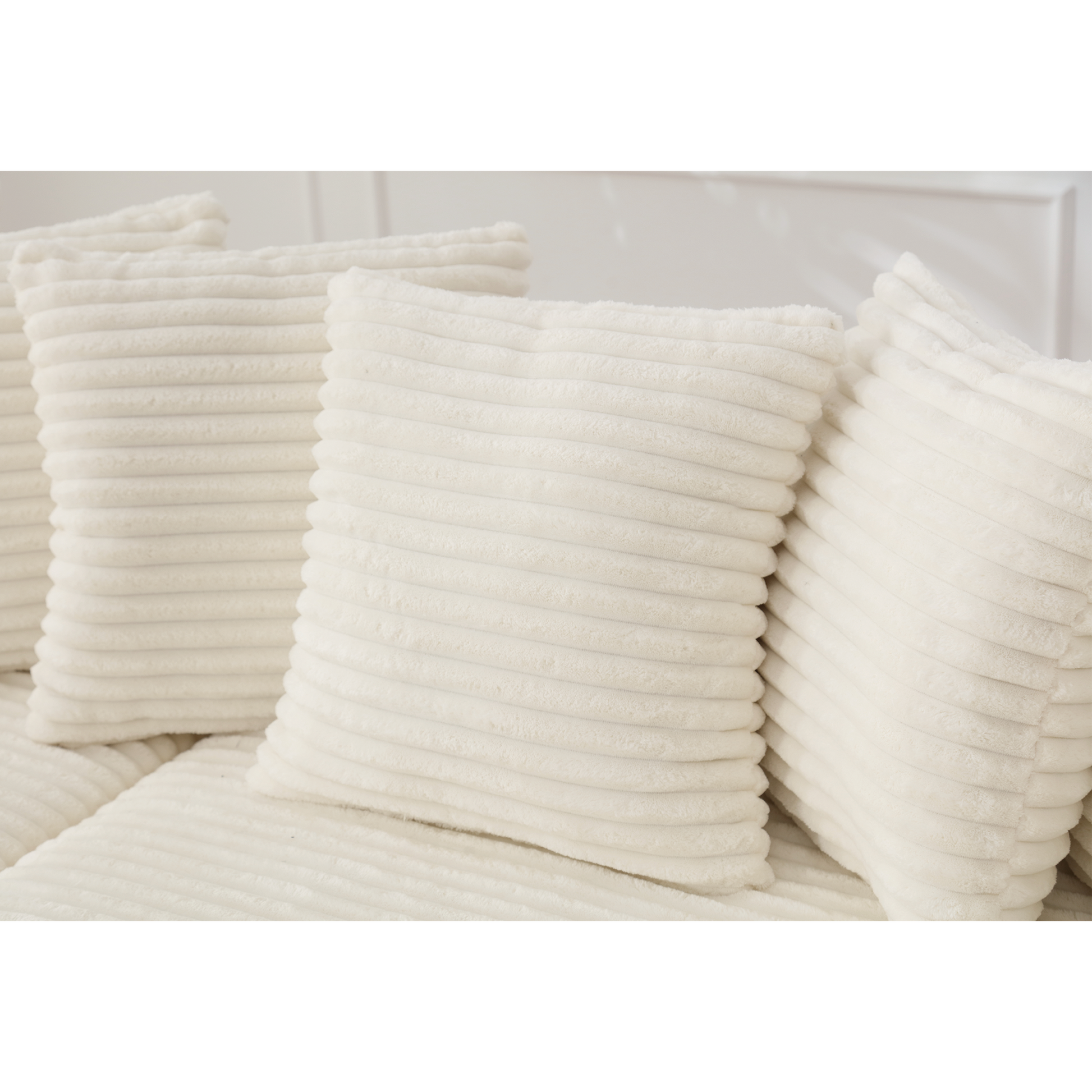 Soft ivory corduroy throw pillows creating a cozy texture for living room decor