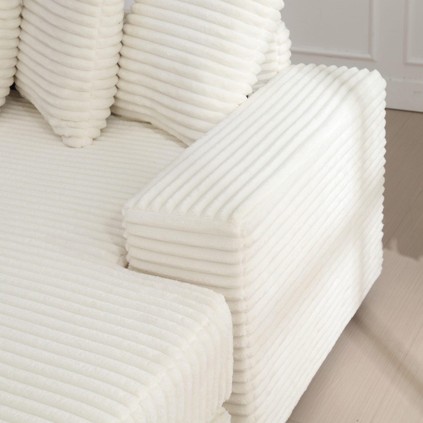 Plush cream corduroy sofa with ribbed texture a cozy seating option
