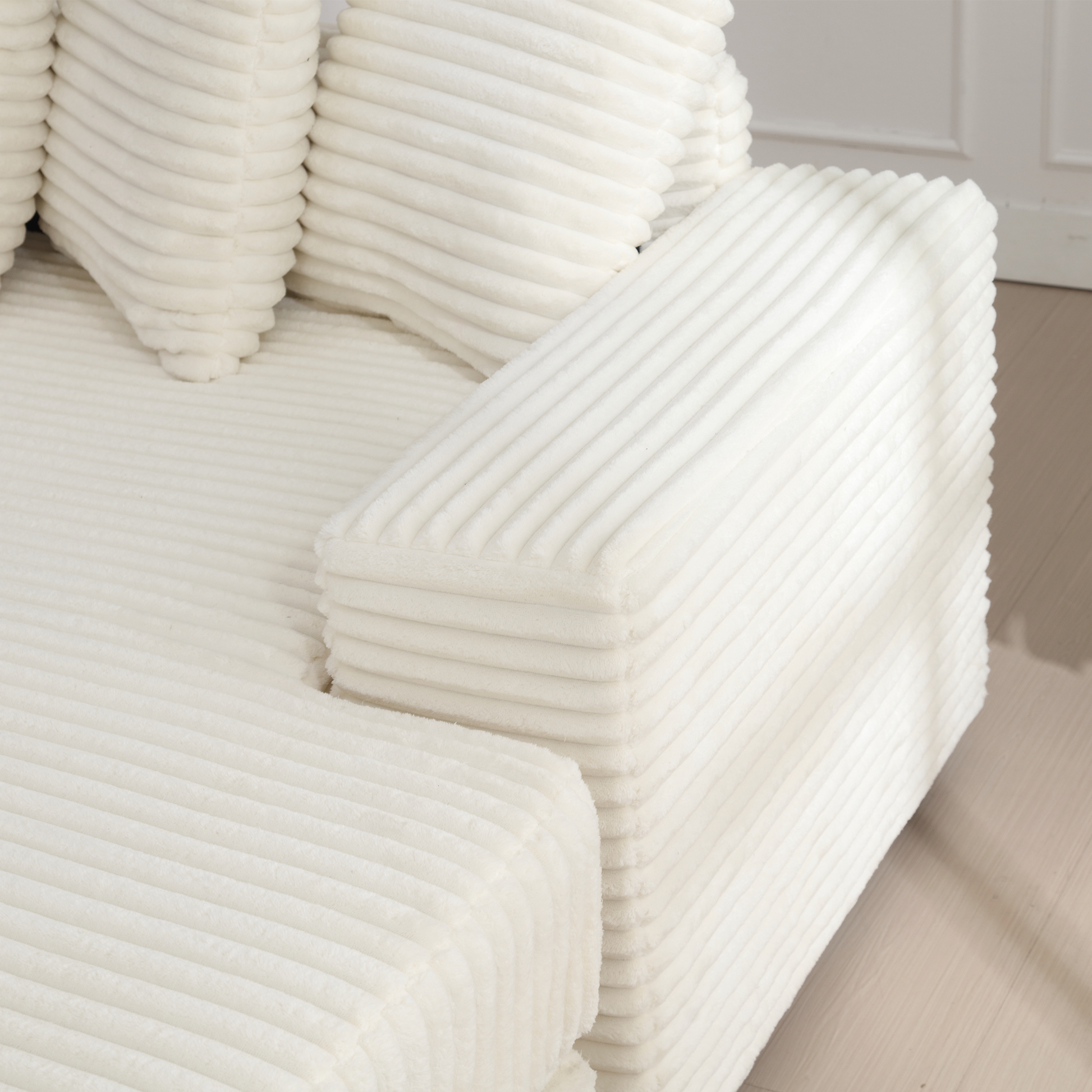 Plush cream corduroy sofa with ribbed texture a cozy seating option