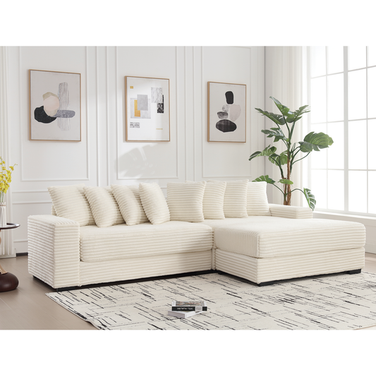 Cream corduroy sectional sofa with plush throw pillows in a modern living room setting