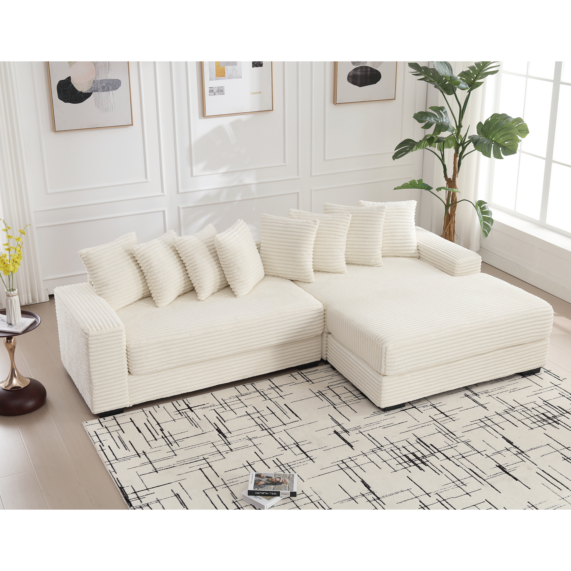 Cream corduroy sectional sofa with plush throw pillows and chaise lounge
