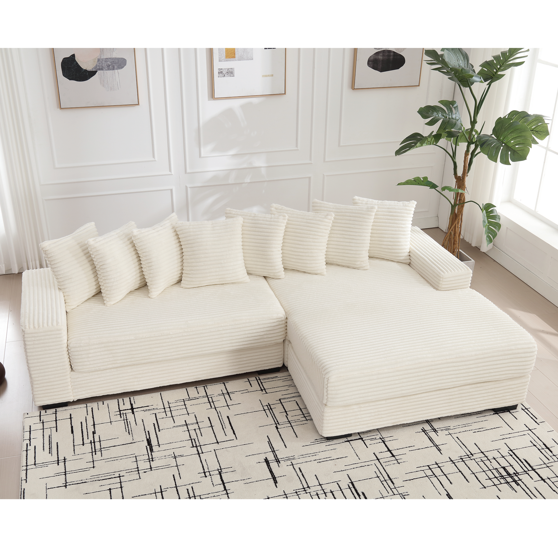 Plush ivory corduroy sectional sofa with matching throw pillows