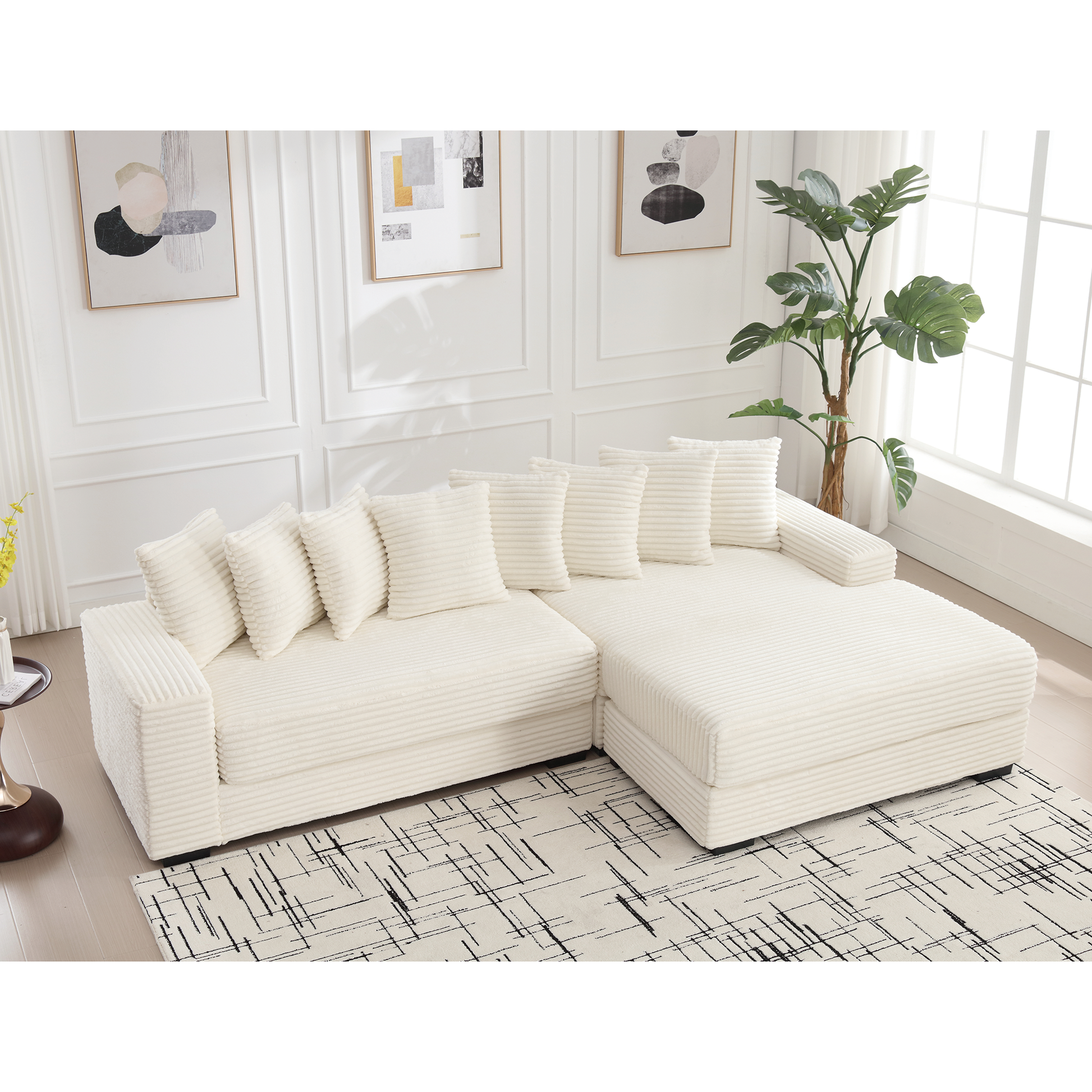 Plush cream corduroy sectional sofa with matching throw pillows and chaise lounge