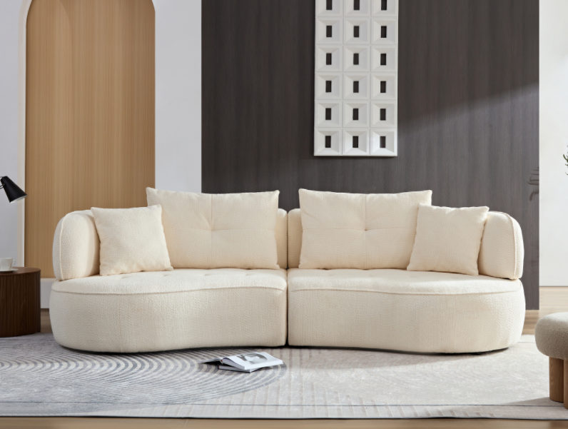 Cream boucle fabric curved sectional sofa with plush throw pillows perfect for modern living room