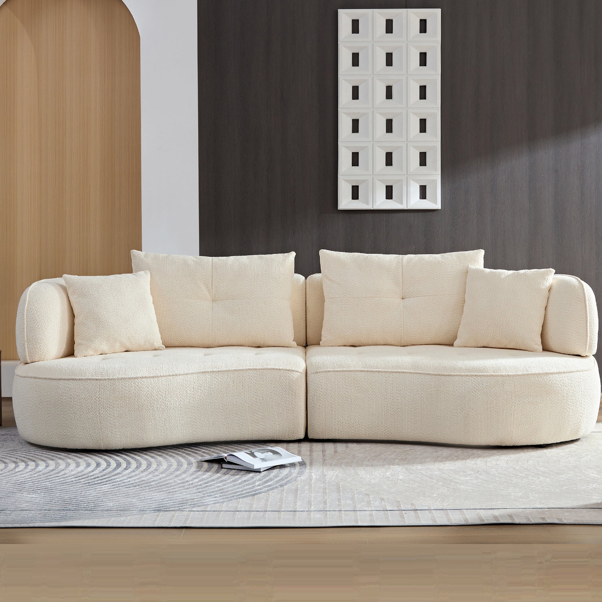 Cream boucle modular sofa with plush throw pillows for a cozy living room setting