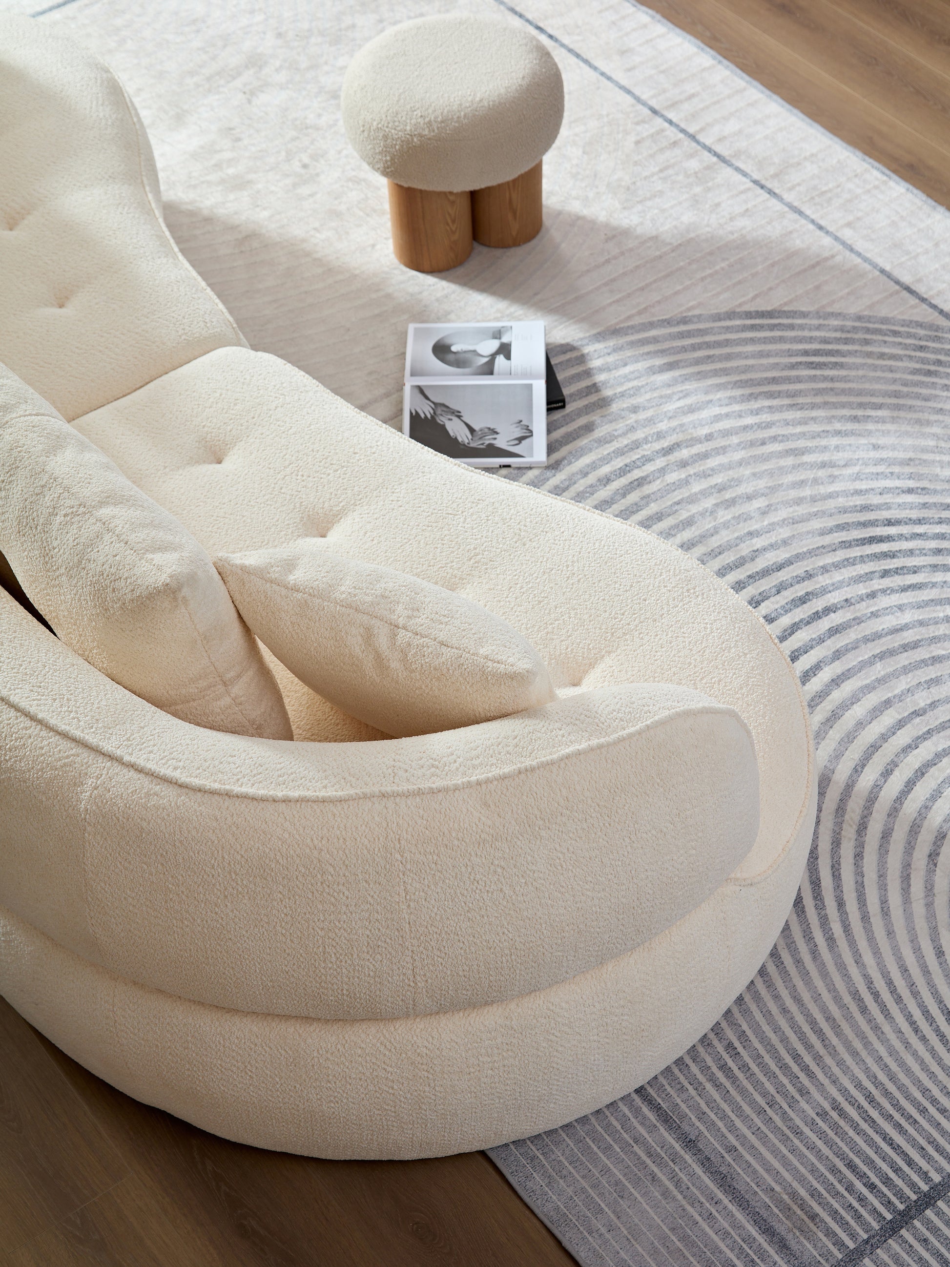 Cream boucle modular sofa with tufted cushions and accent pillows
