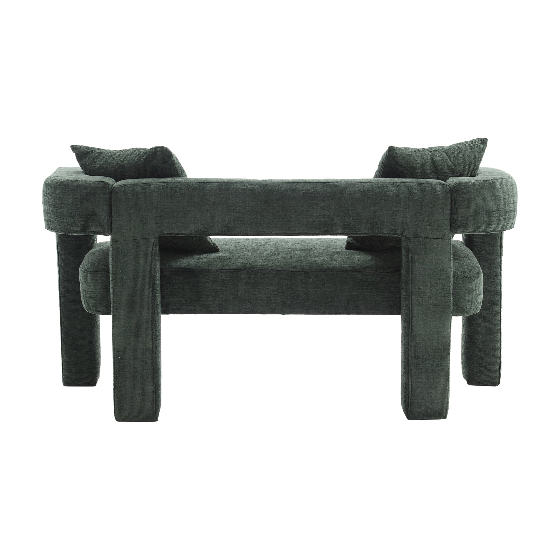 Dark green upholstered armchair with block legs and two throw pillows