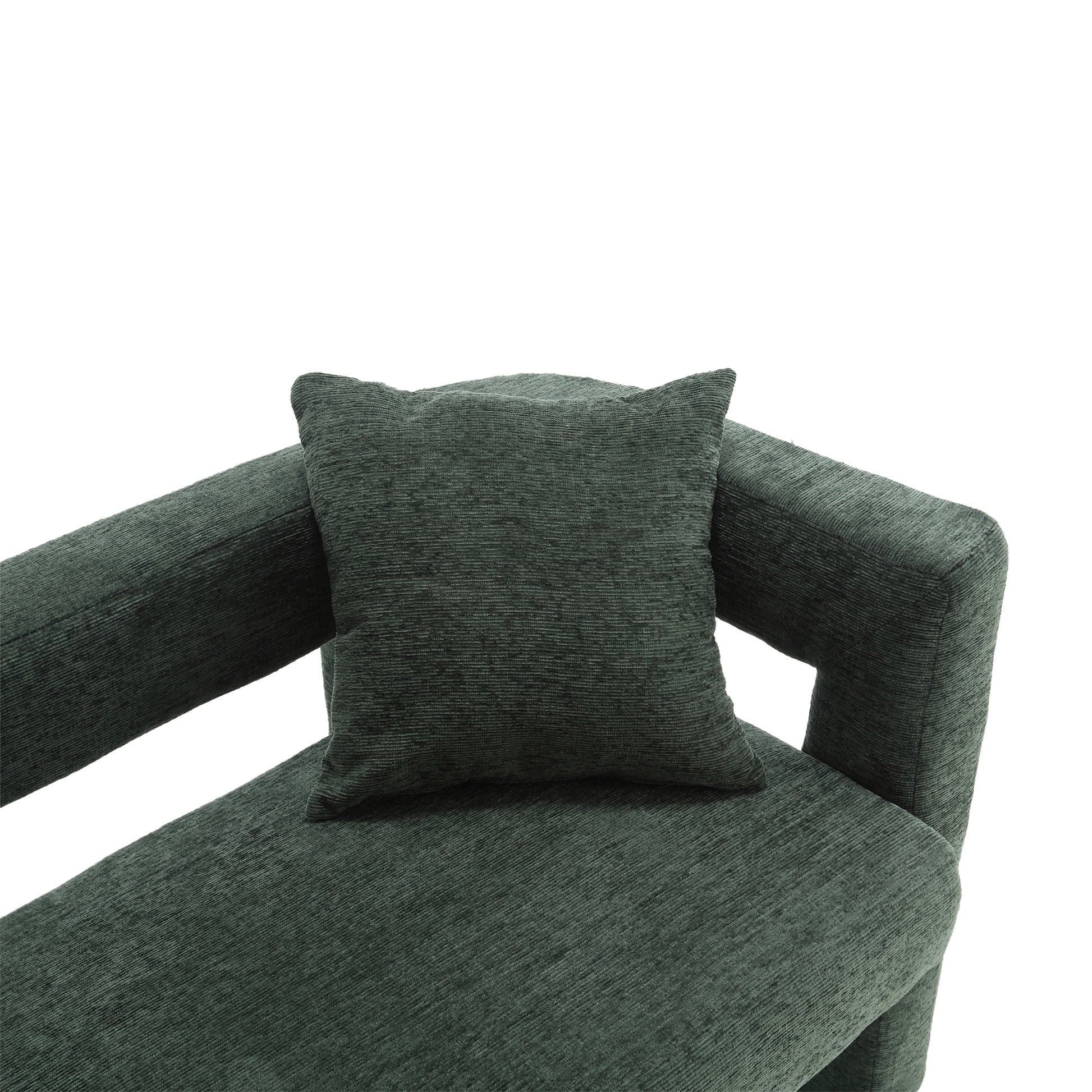 Closeup of a dark green corduroy accent pillow on a matching sofa section