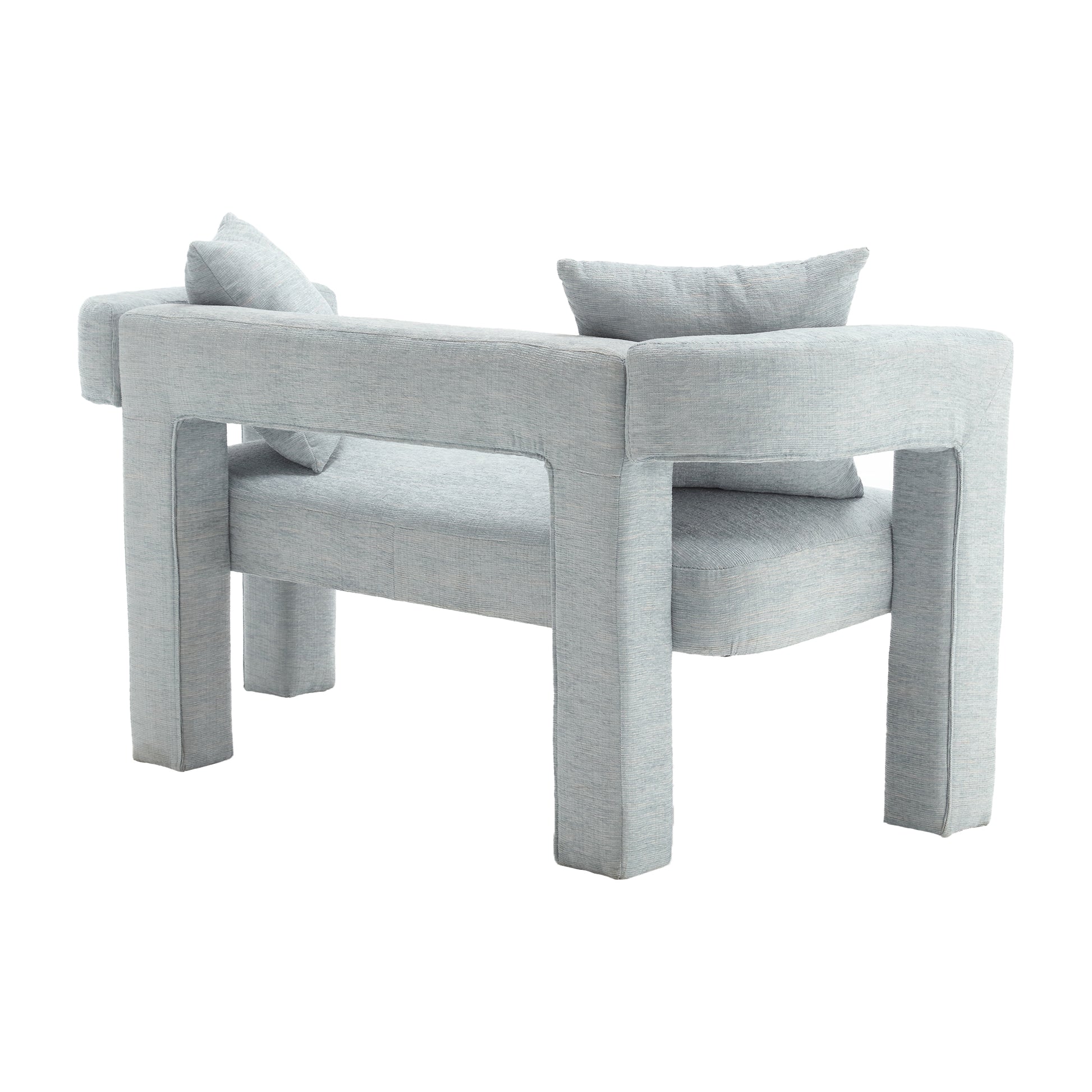 Pale blue textured fabric armchair with contemporary block design and matching throw pillows