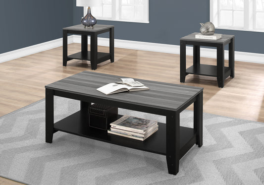 Gray striped coffee table with black frame and lower shelf holding magazines and a decorative box