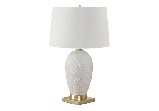 Textured white ceramic table lamp with gold base and white drum shade