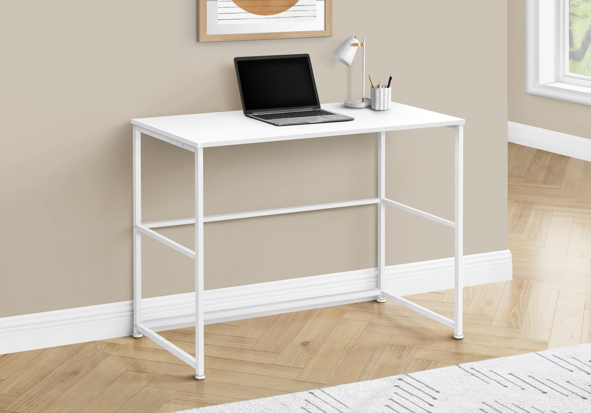 Minimalist white metal frame standing desk with a white laminate top