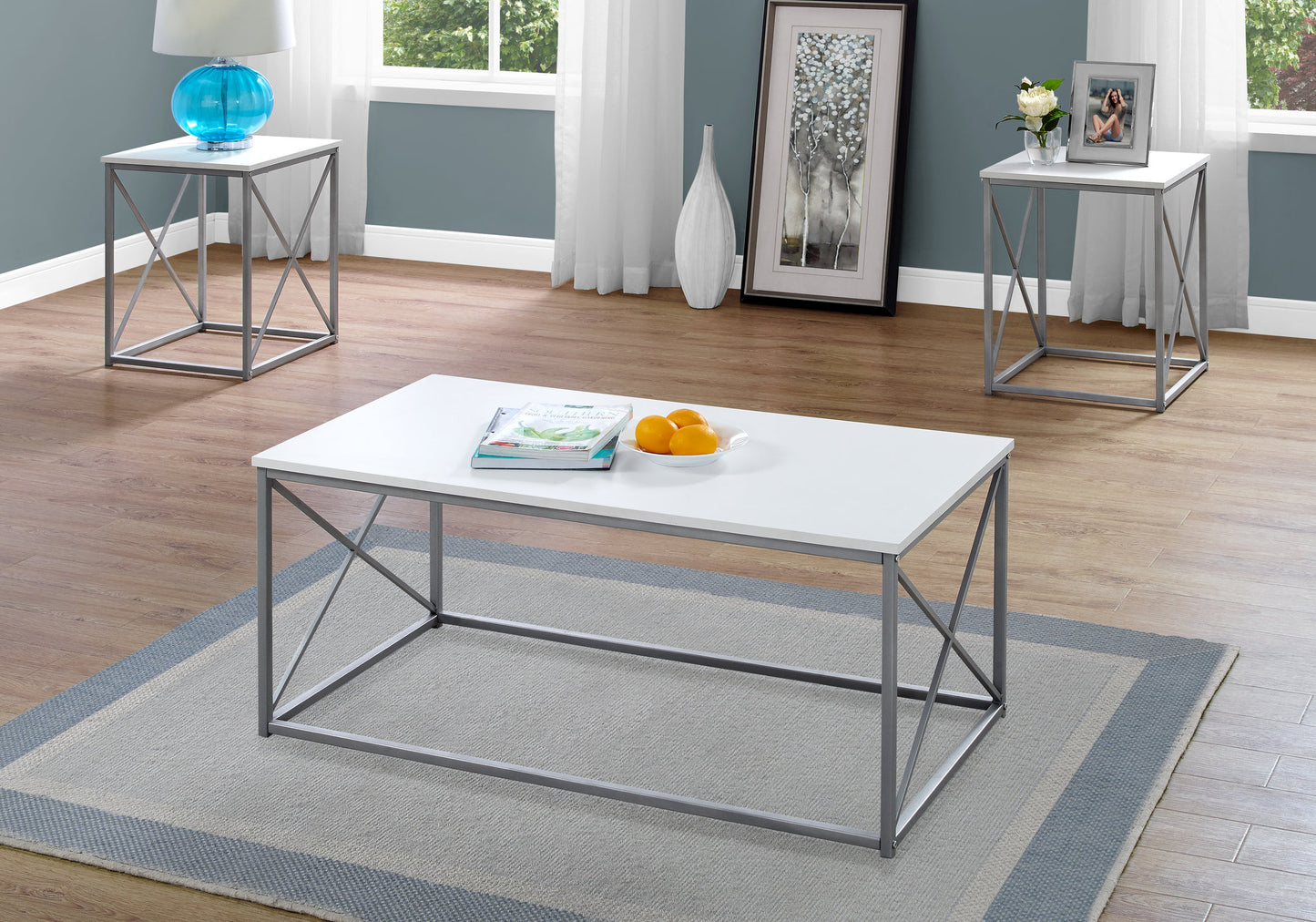 White rectangular coffee table with gray metal frame modern design on a rug
