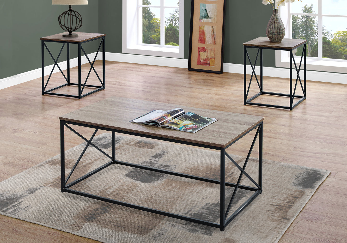 Industrial style coffee table with oaklook top and black metal frame magazines on top