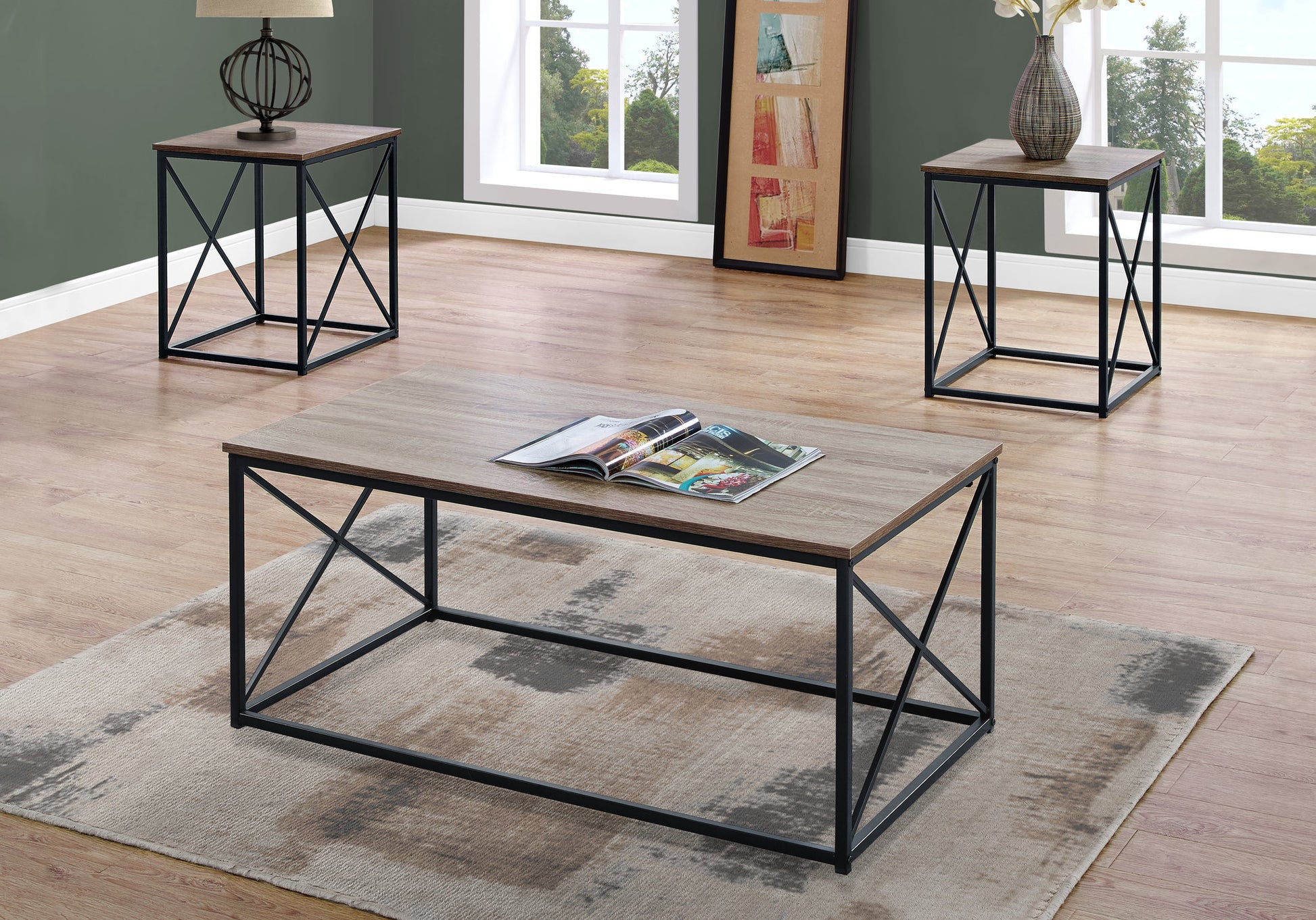 Industrial style coffee table with oaklook top and black metal frame magazines on top