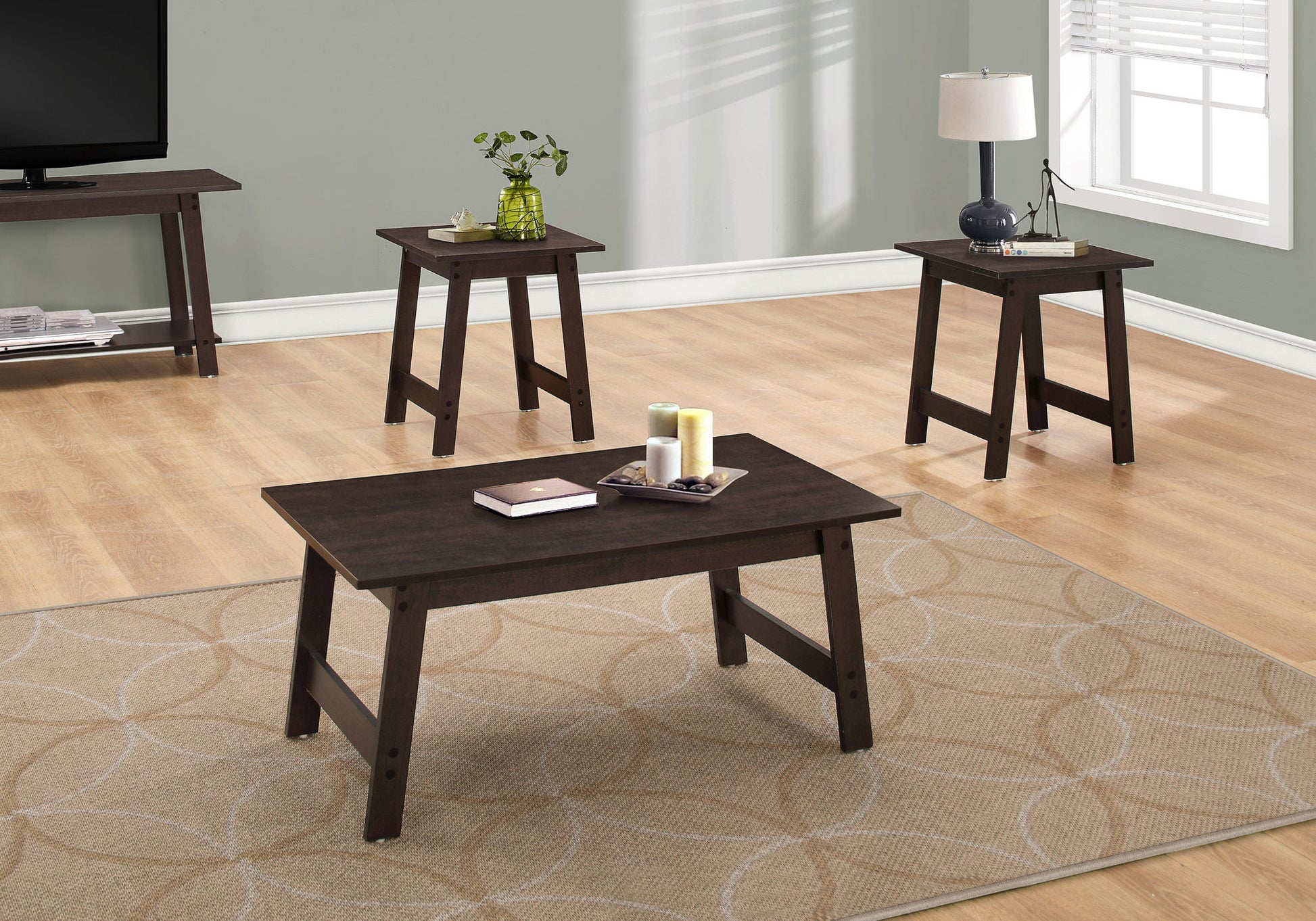 Dark brown rectangular coffee table with a book and candles