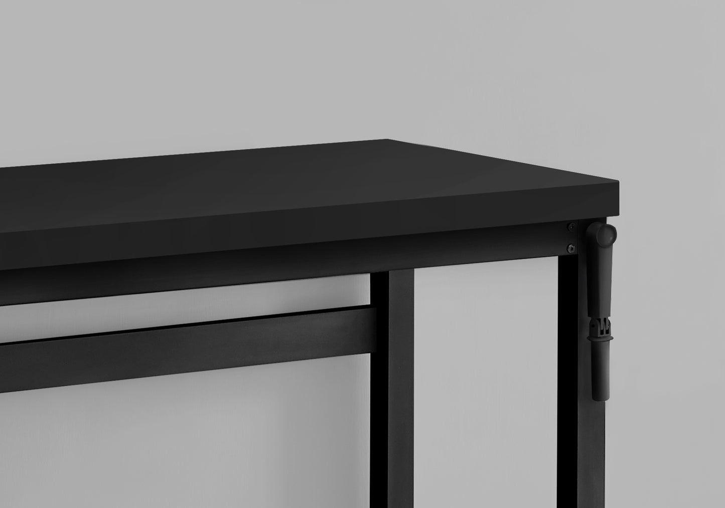 Sleek black console table with minimalist metal legs and a thin top surface