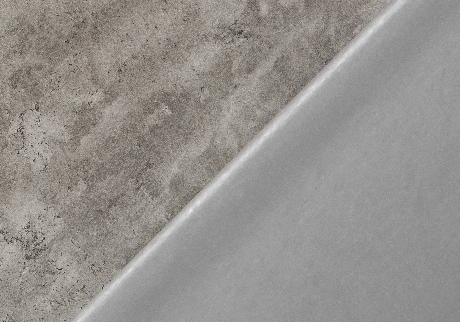 Textured grey concrete panel with a smooth light grey surface