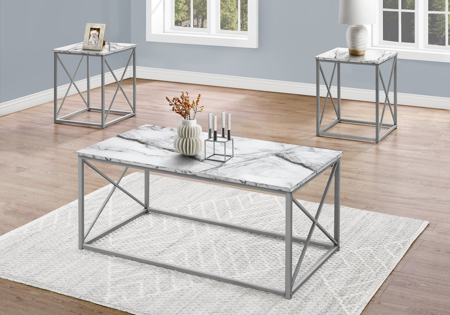 Modern marble top coffee table with gray metal frame set in a living room