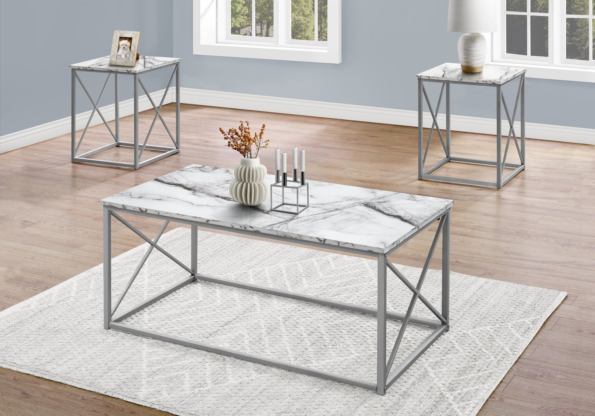 Modern marble top coffee table with gray metal frame set in a living room