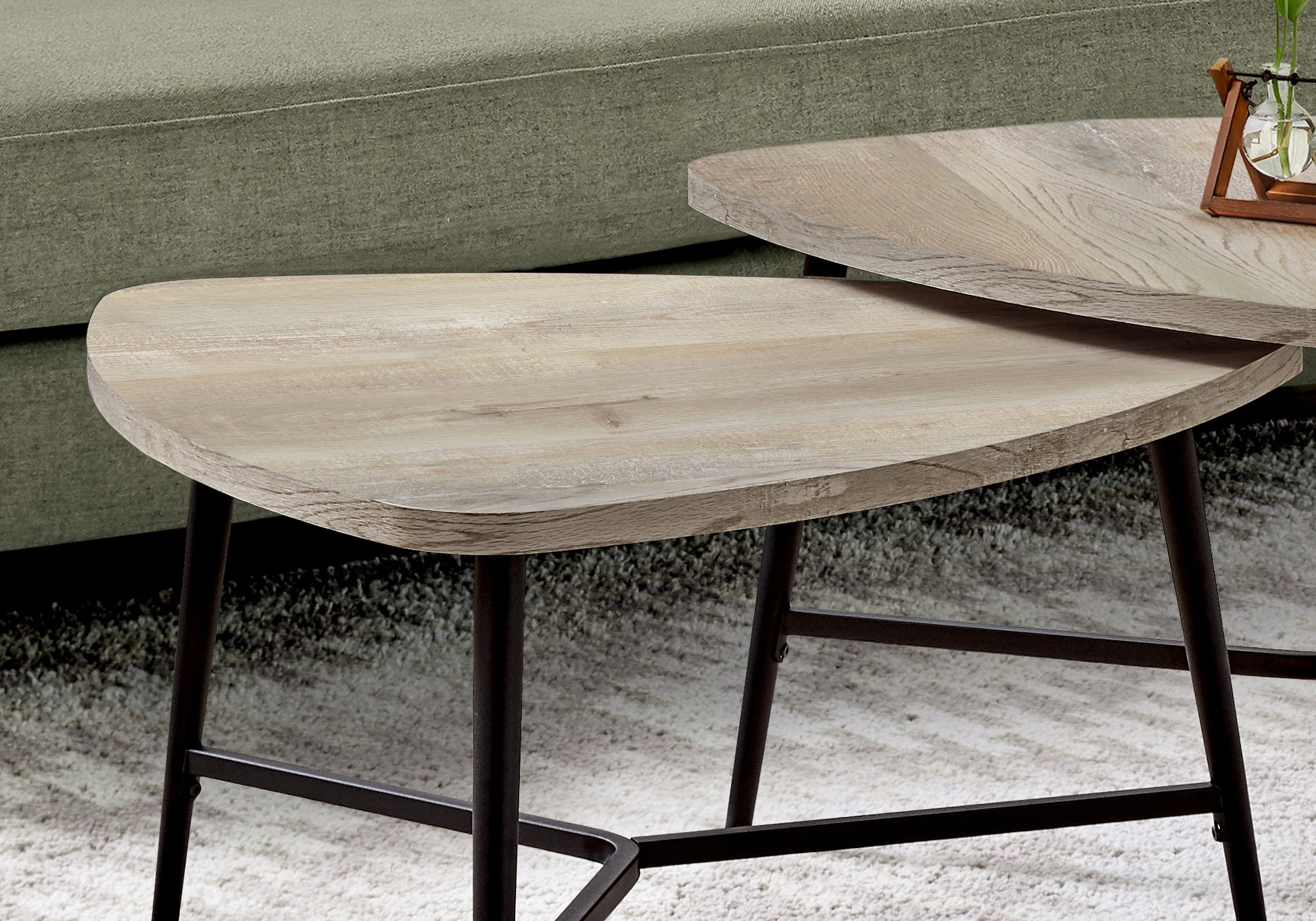 Light wood nesting coffee tables with modern metal legs