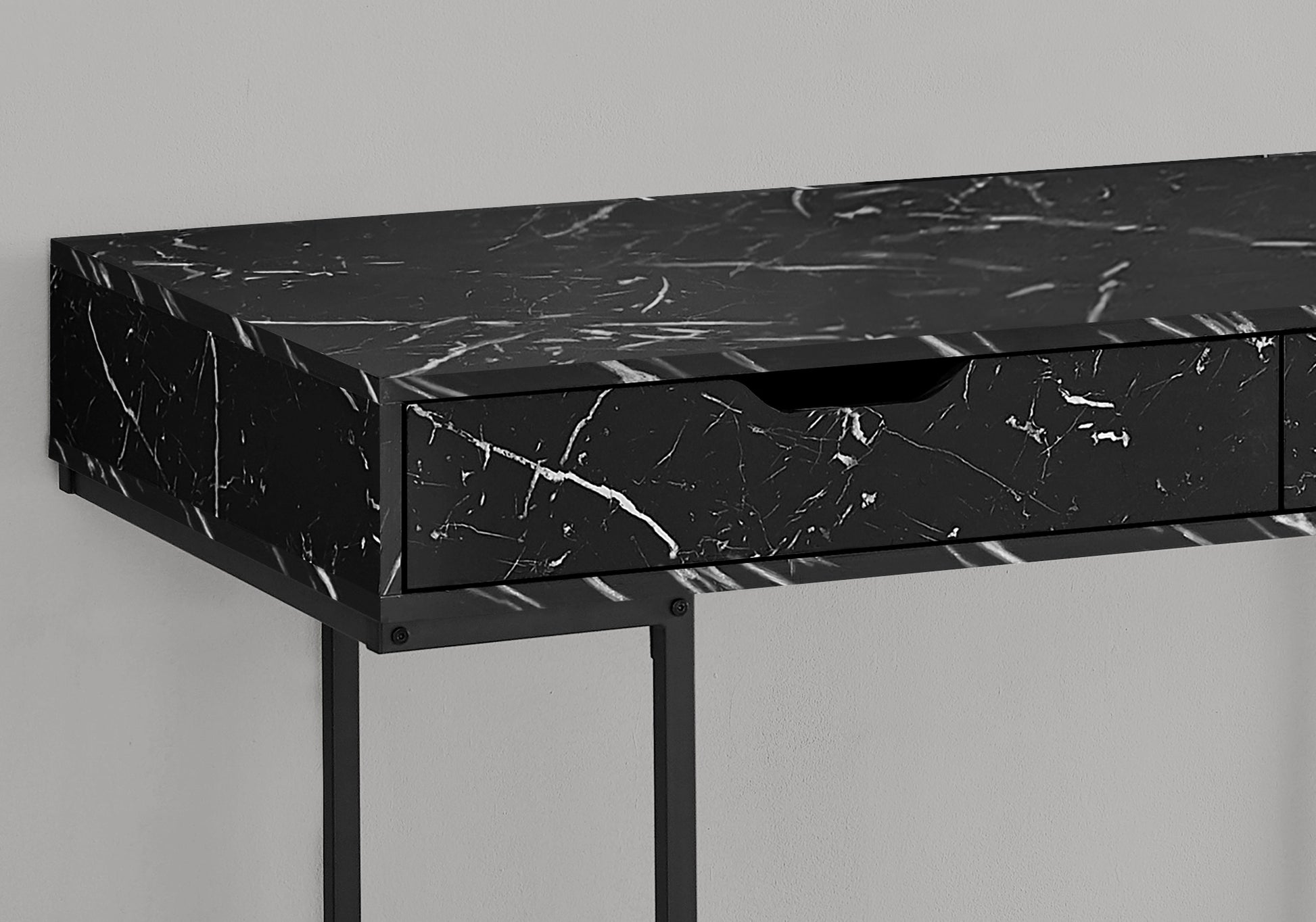 Sleek black marble console table with a single drawer and matte black metal legs