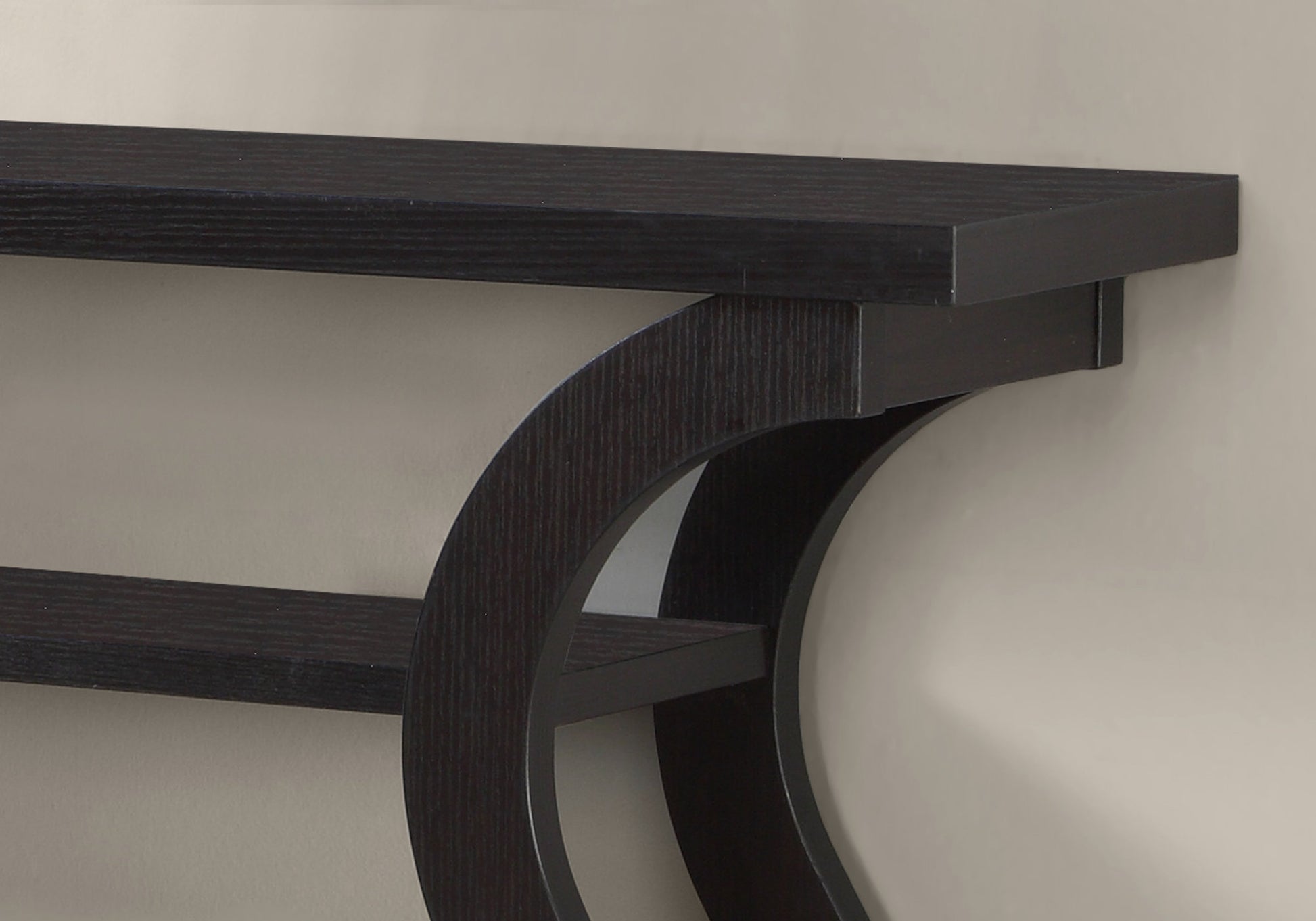 Dark wood floating shelf with curved bracket support for modern living room