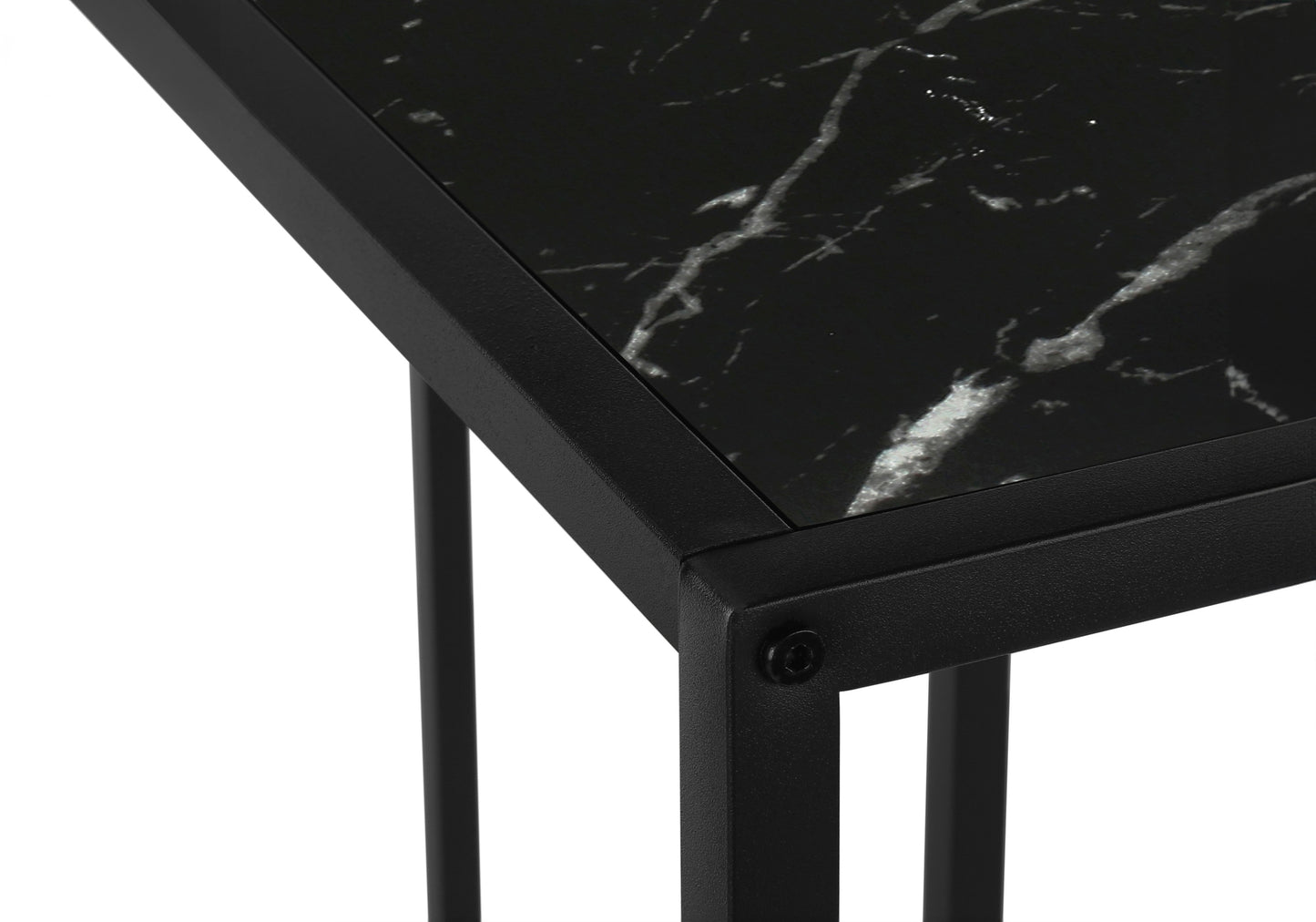 Closeup of a modern black marble side table with a matte black metal frame