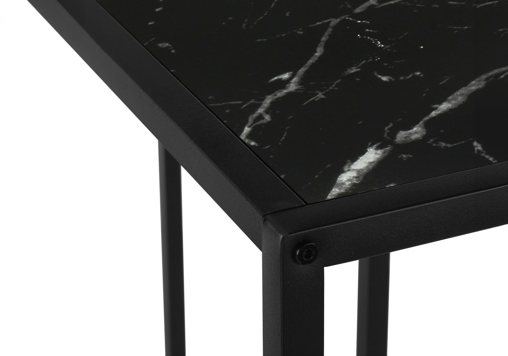 Closeup of a modern black marble side table with a matte black metal frame