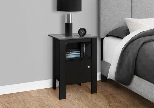 Black MDF nightstand with faux wood top featuring a drawer and shelf with books