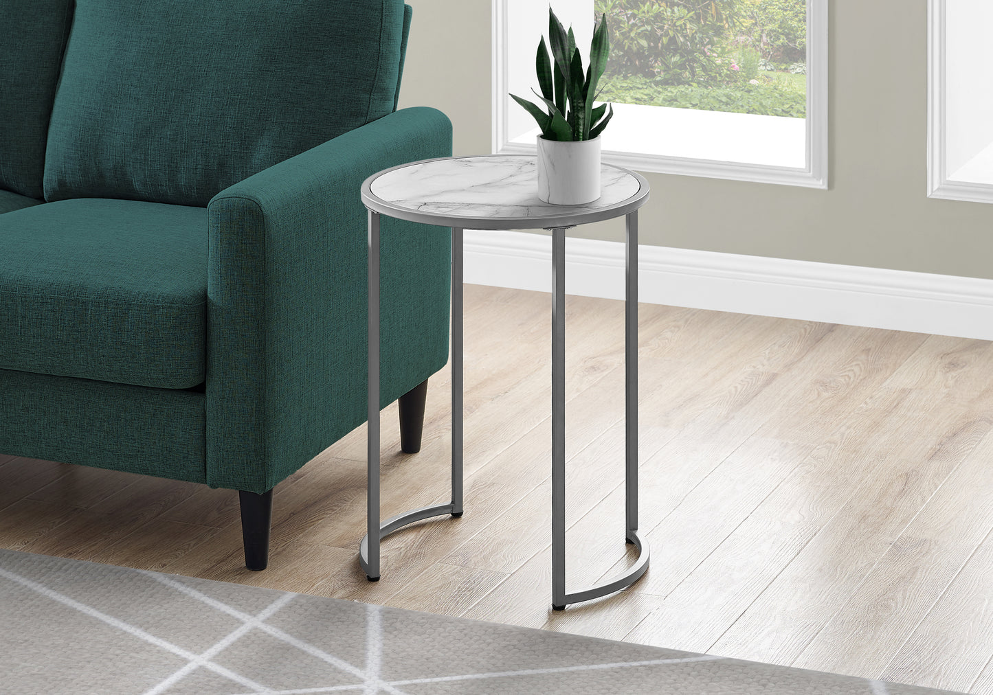 Round marble accent table with a silver metal frame perfect for living rooms