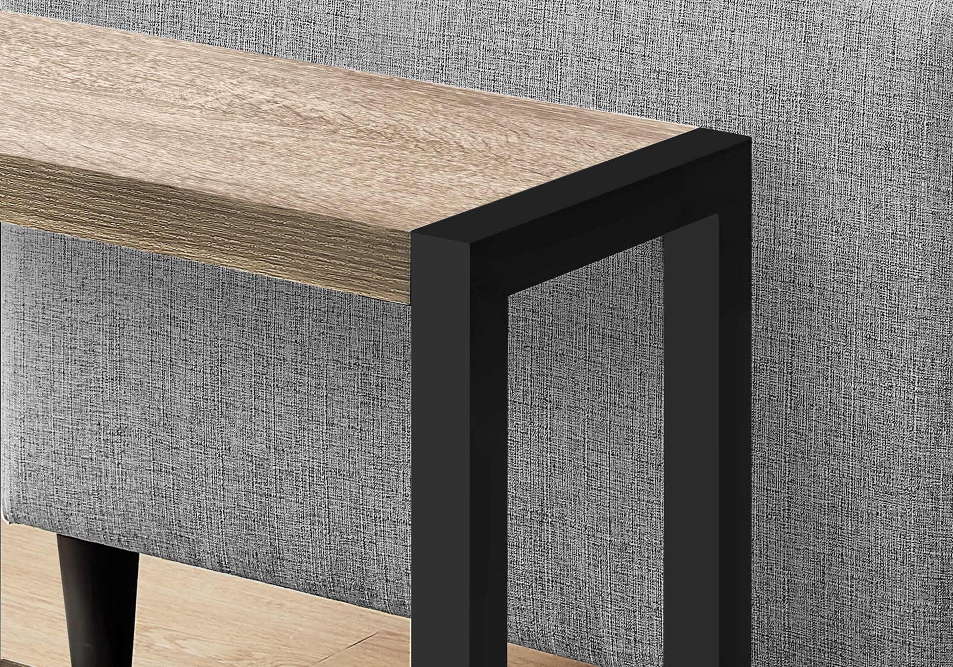 Wooden console table with black metal frame and textured gray upholstery