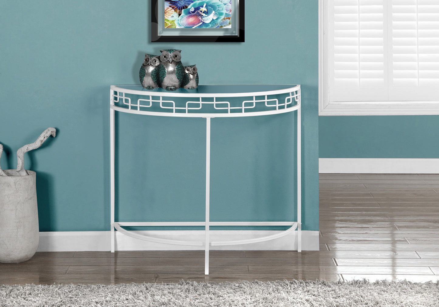 White metal halfmoon console table with geometric cutout detail