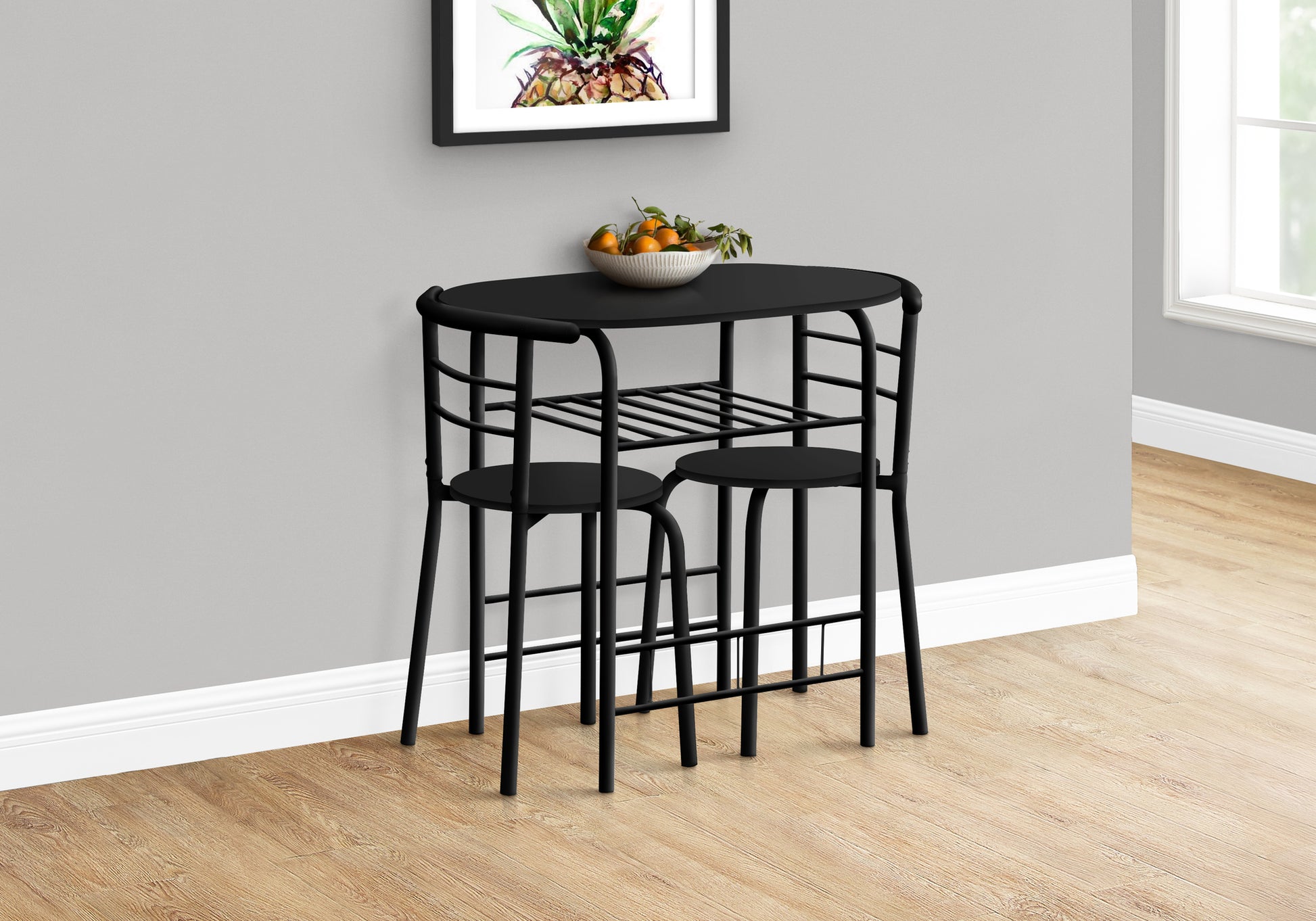 Black metal bistro set with two stools and oval tabletop perfect for small spaces