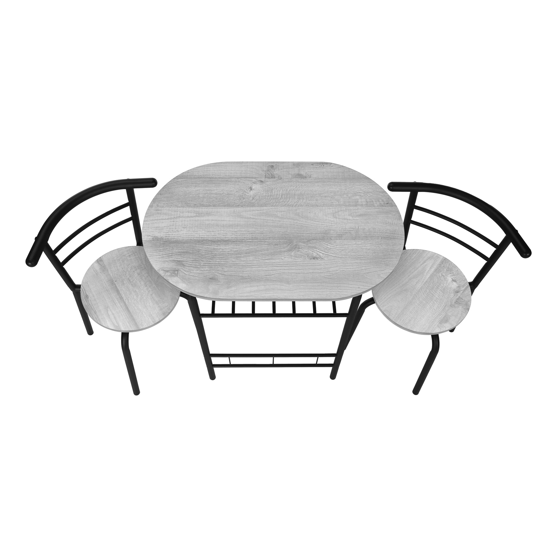 Grey wood grain oval dining table with two black metal chairs perfect for small spaces