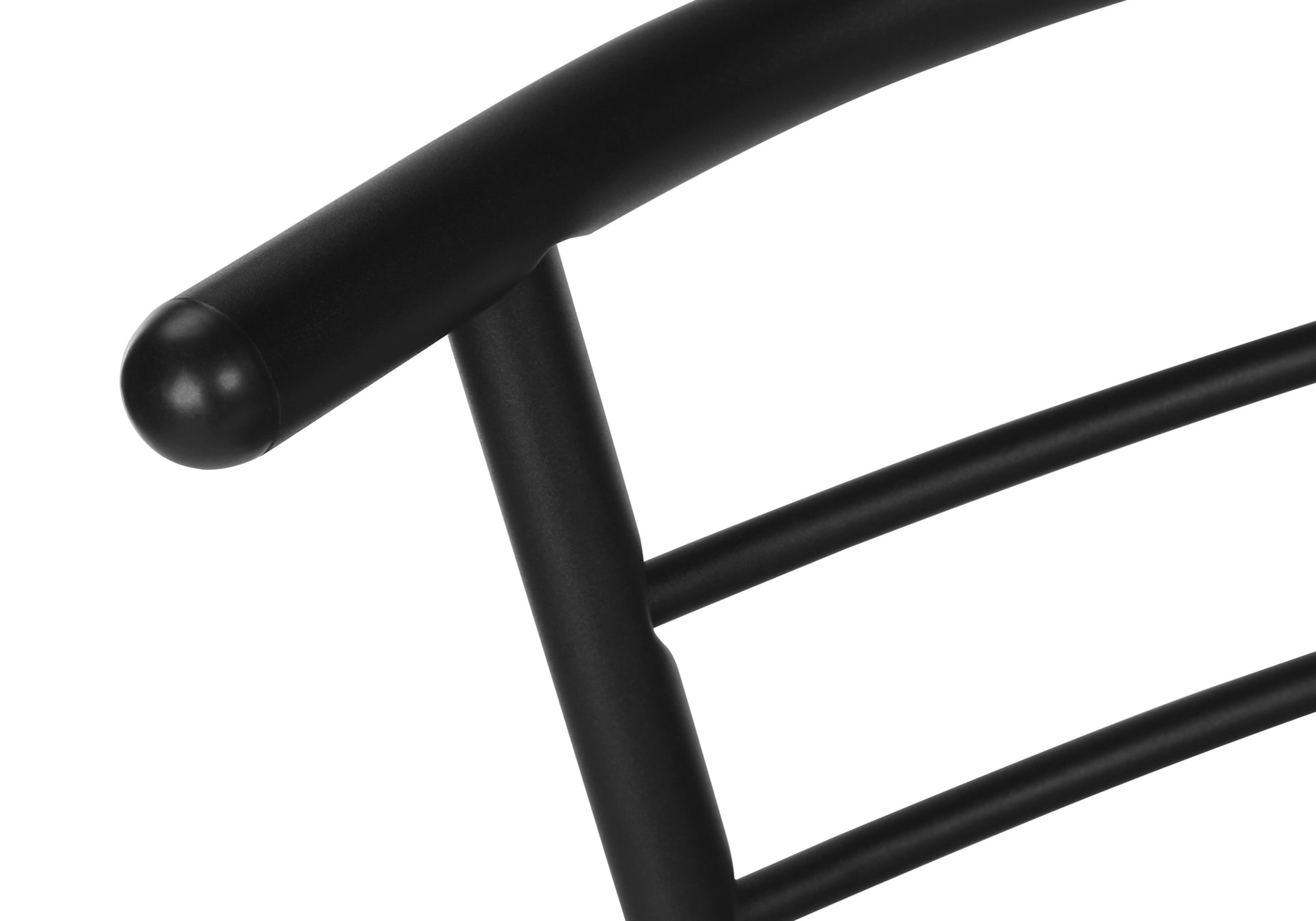 Closeup of black metal chair frame with rounded armrest