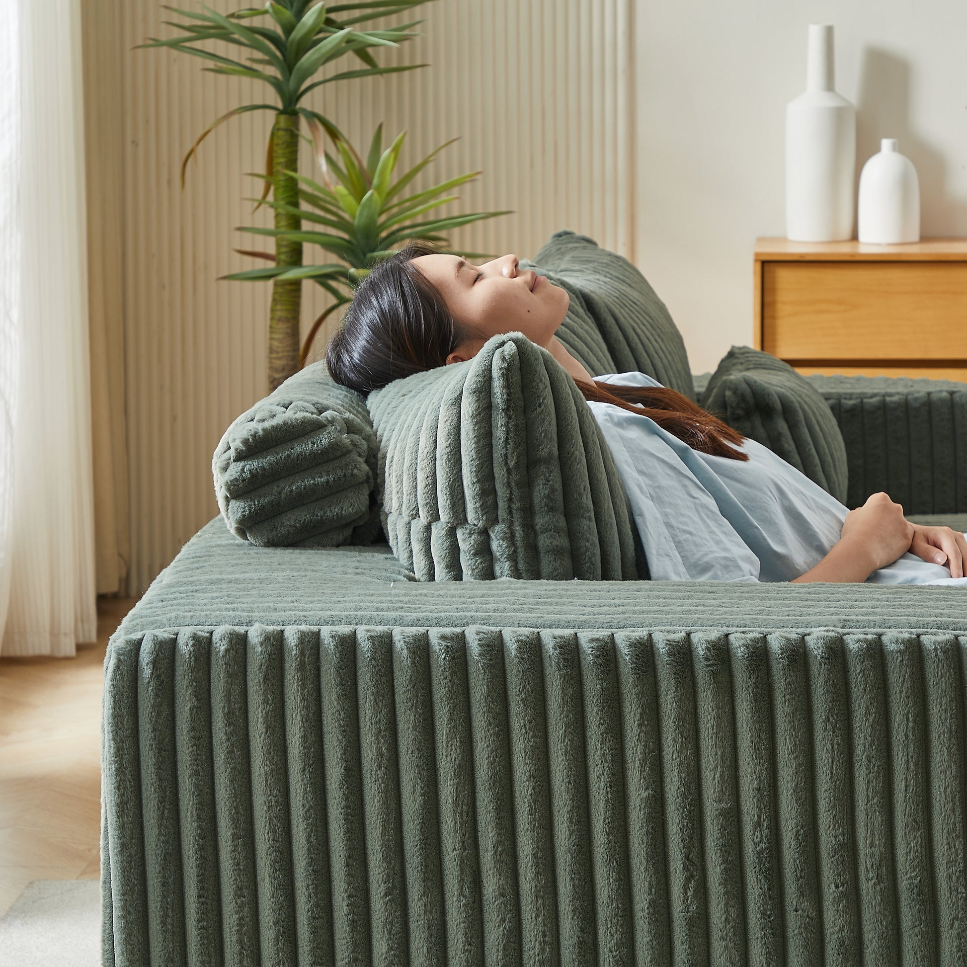 Sage green corduroy sofa with plush texture perfect for cozy living rooms