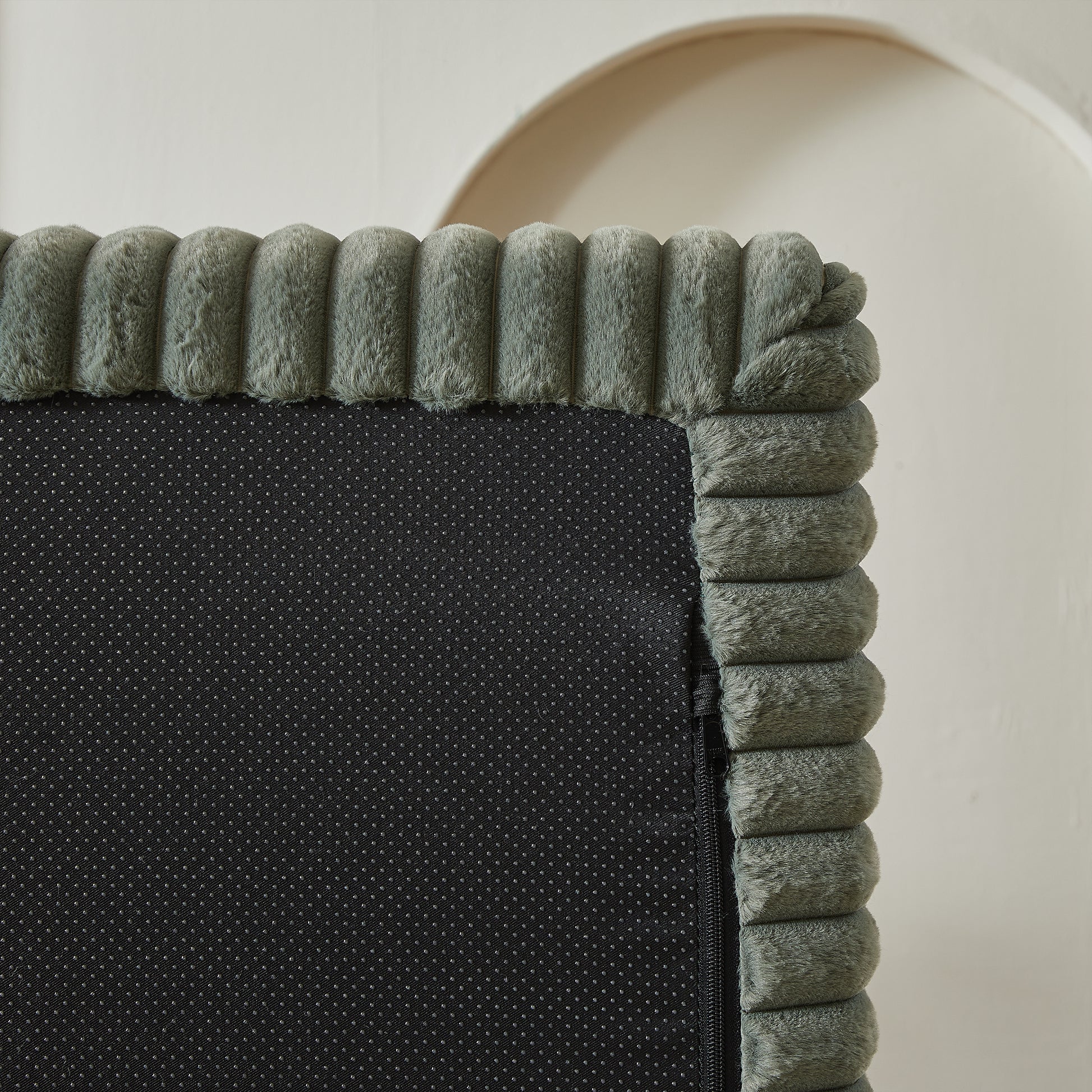 Closeup of a textured grey plush trim with ribbed detail on a black nonslip backing