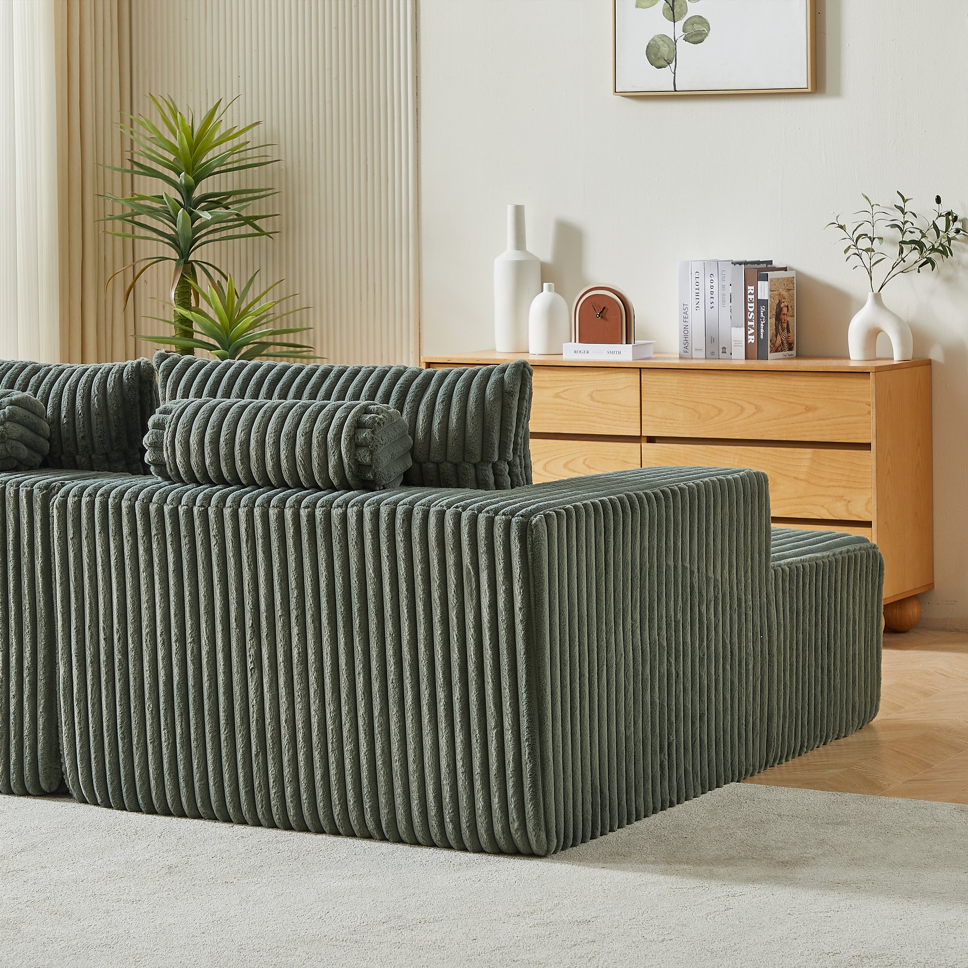 Deep green corduroy sectional sofa with plush texture offering modern living room comfort