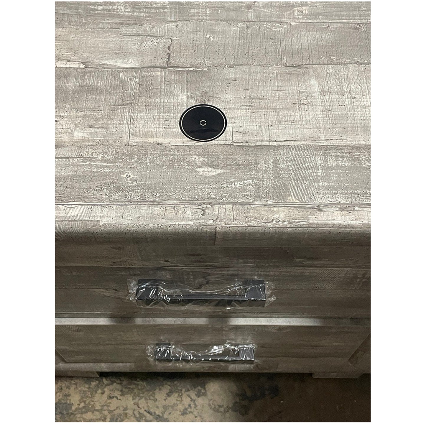 Rustic grey wood dresser top with cable management hole and black drawer pulls