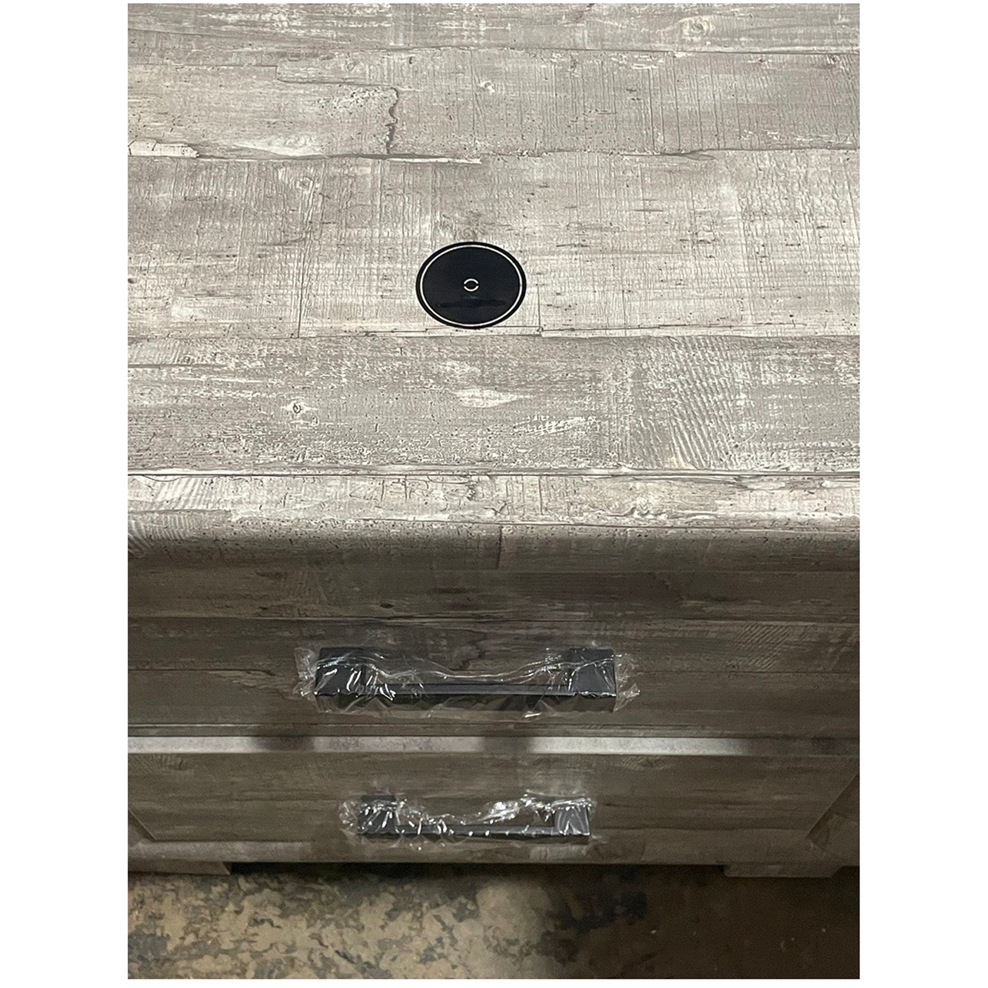 Rustic grey wood dresser top with cable management hole and black drawer pulls