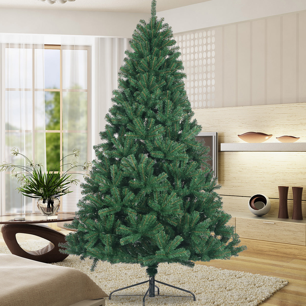 Full artificial Christmas tree with green needles on a black stand