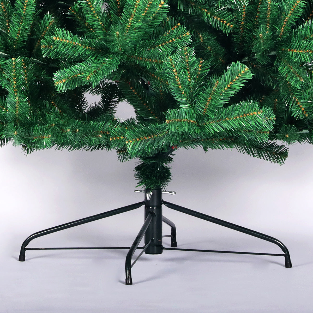 Realistic artificial Christmas tree branches with a sturdy metal stand
