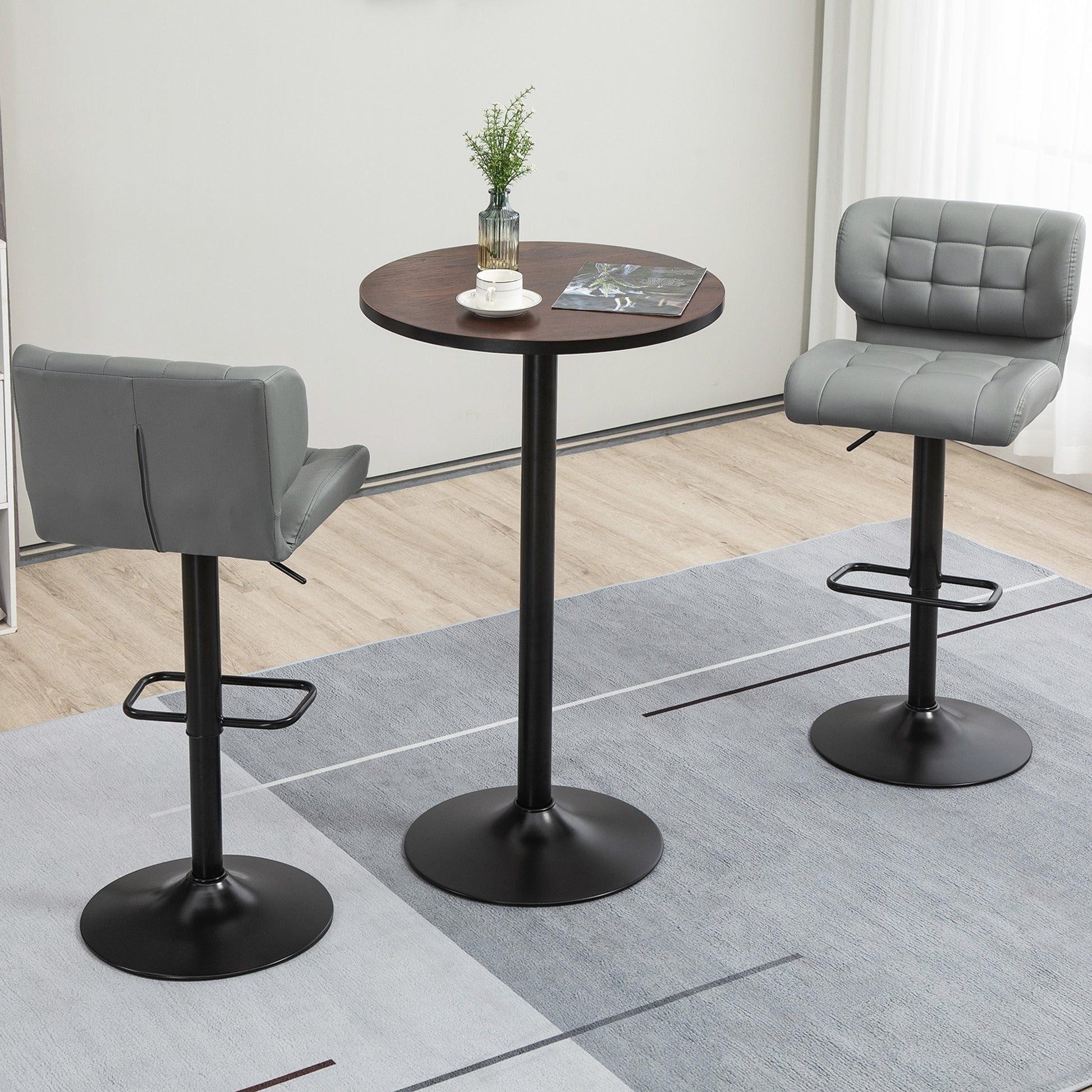 Gray faux leather tufted swivel bar stool with adjustable height and footrest