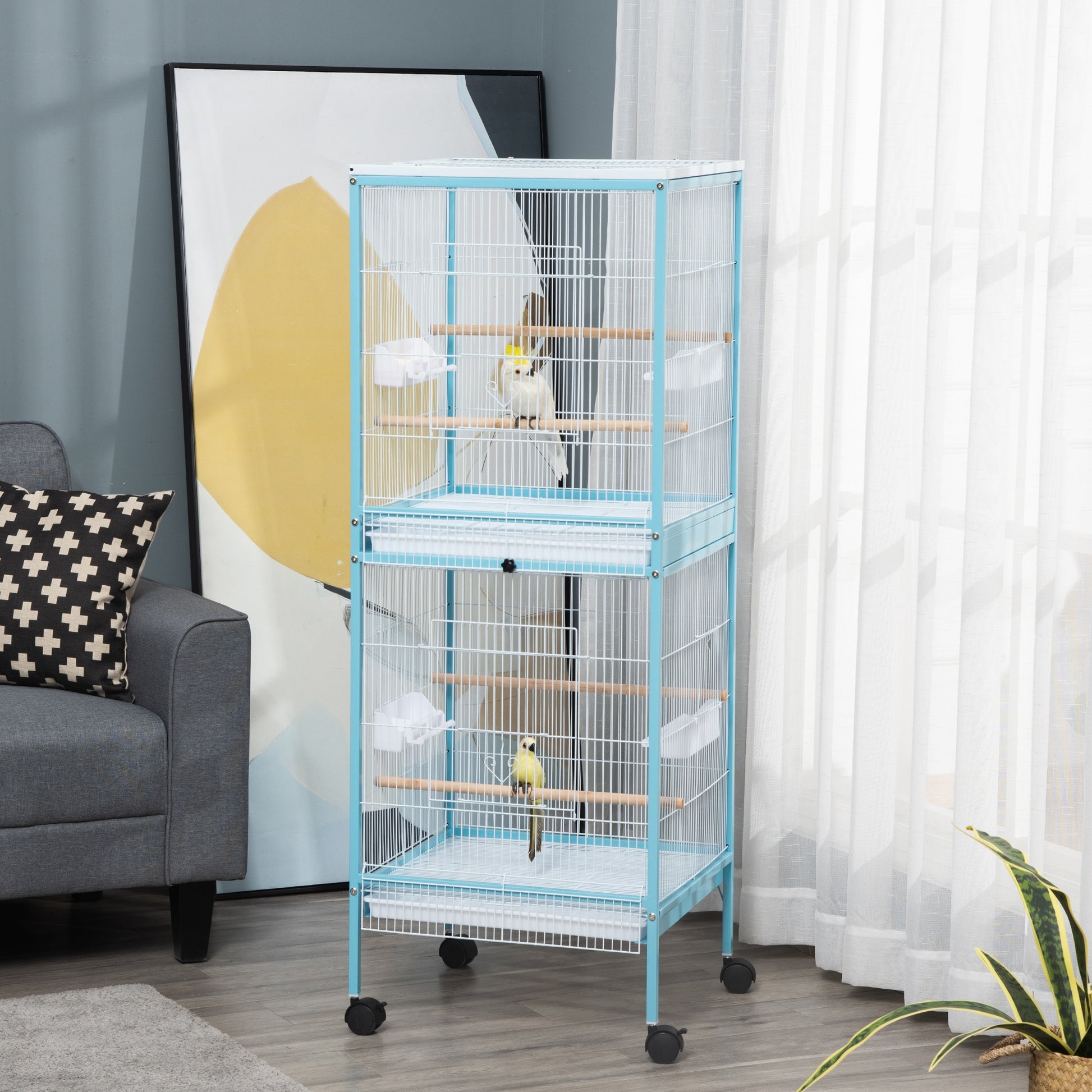 Twotier blue metal bird cage with wooden perches holding two birds