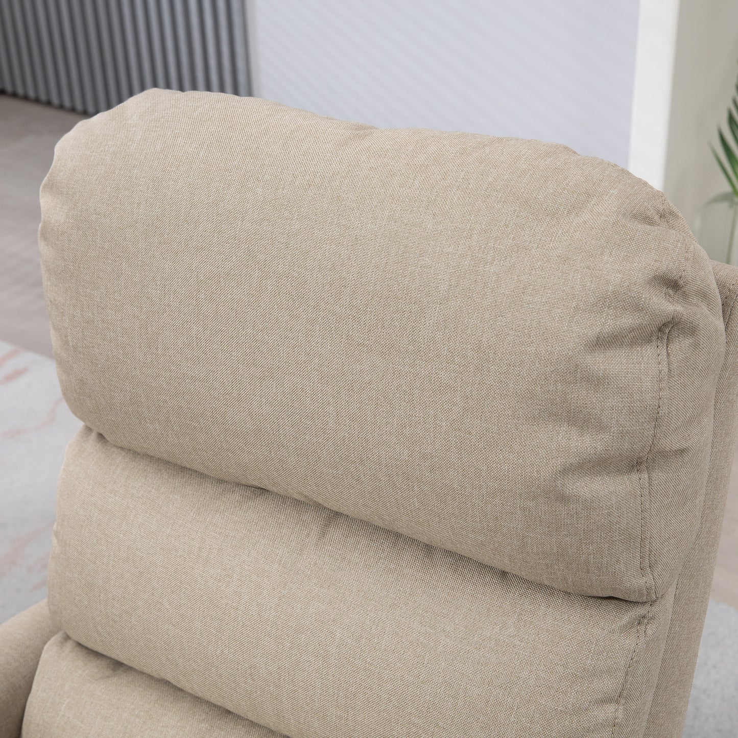 Closeup of plush beige fabric recliner headrest perfect for living room comfort