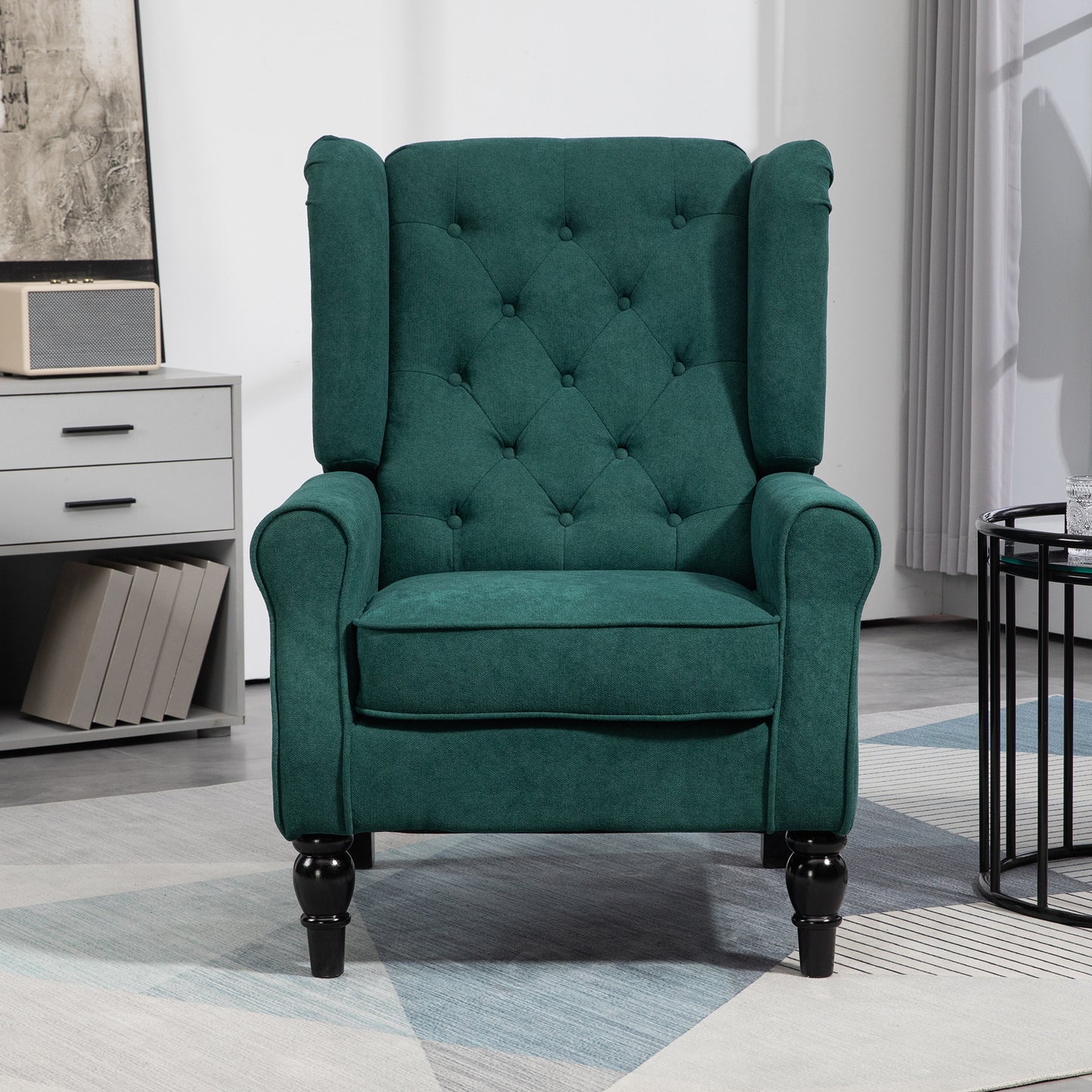 Deep emerald green tufted armchair with ornate black legs a regal accent chair
