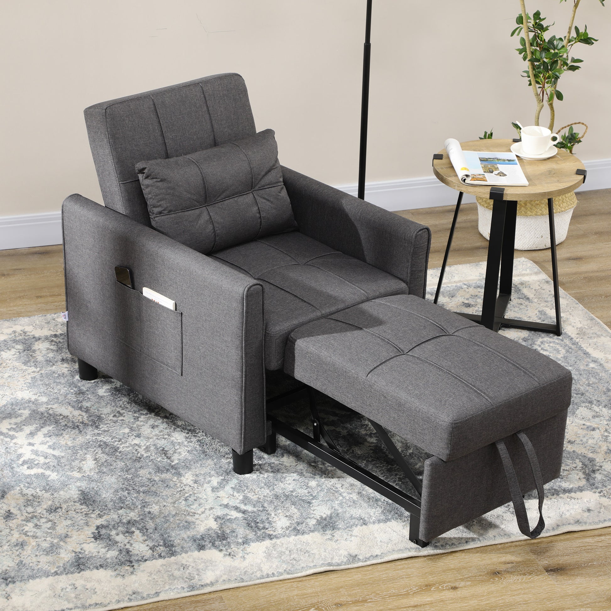 Dark grey fabric convertible sofa chair with footrest extended featuring side pocket storage